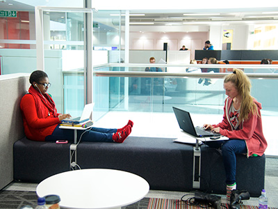 Two students using laptops